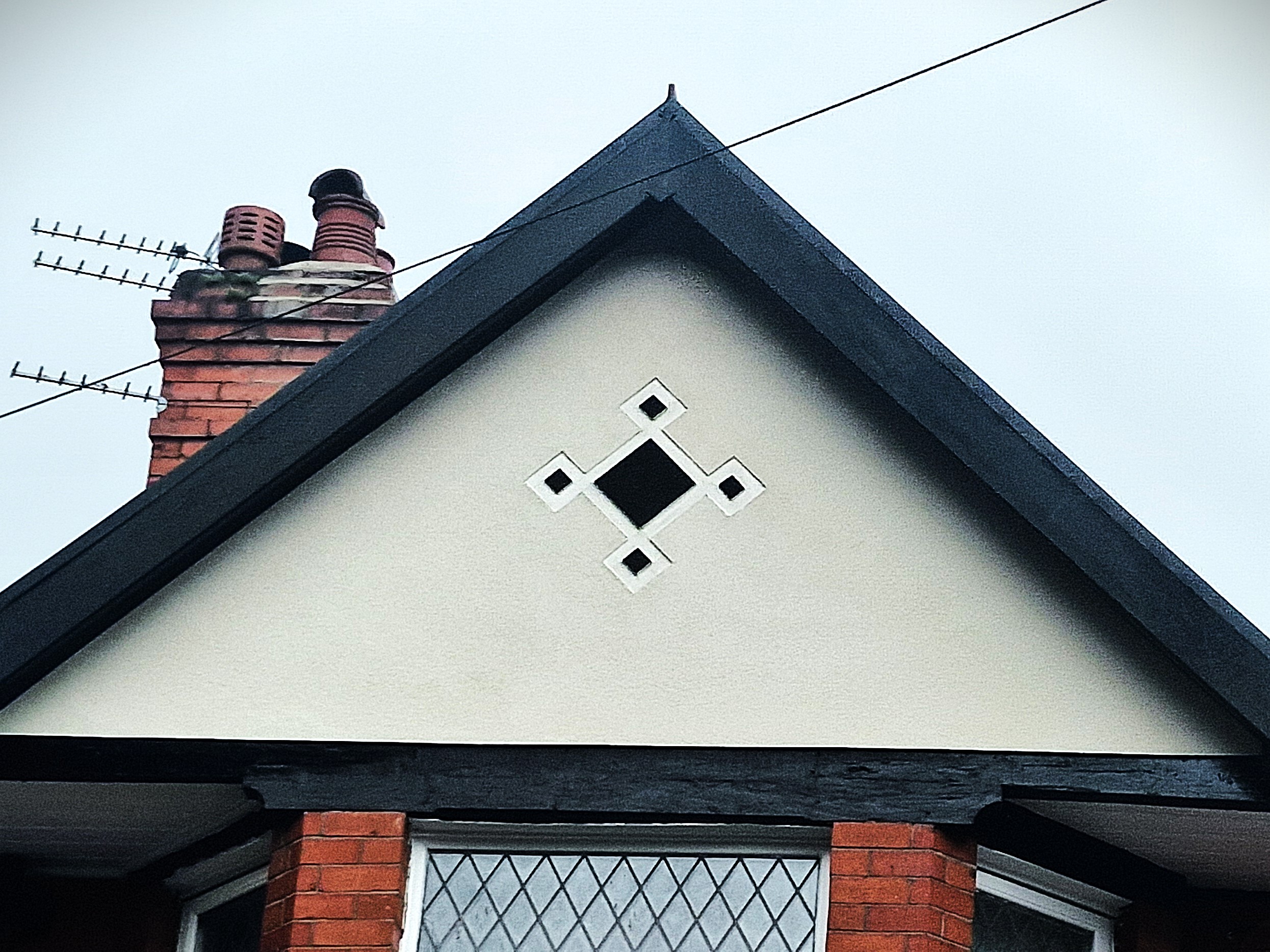 Rendered gable with diamond inlay detail